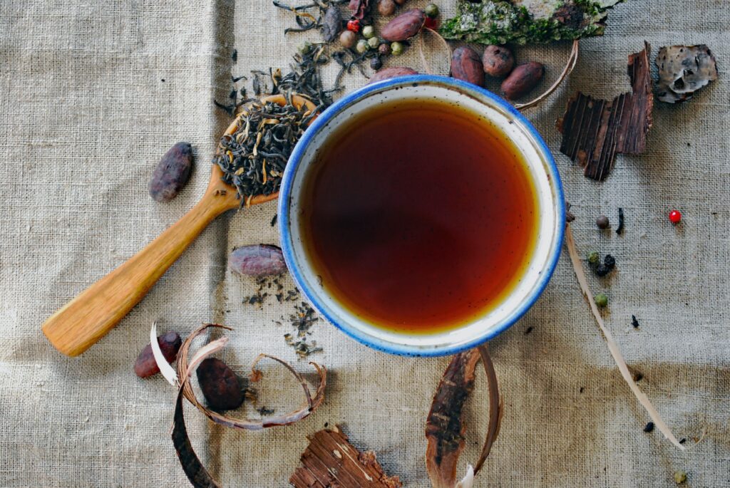Image of a cup of tea and herbs.