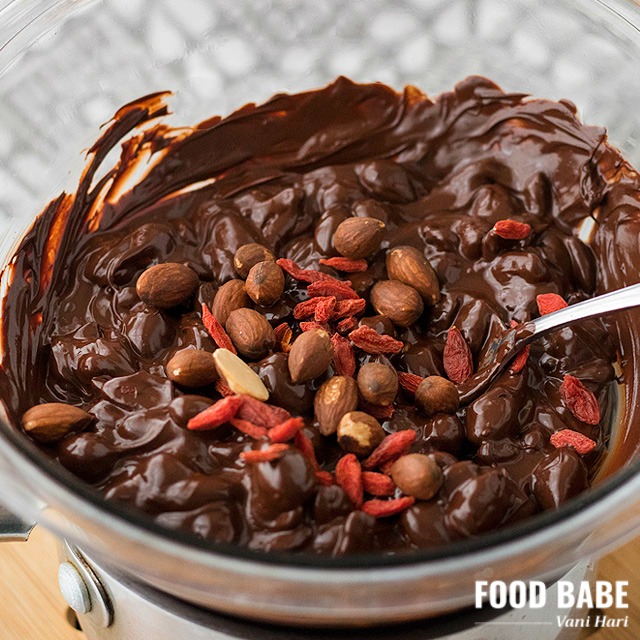 Image of melted chocolate blended with goji berries and almonds.