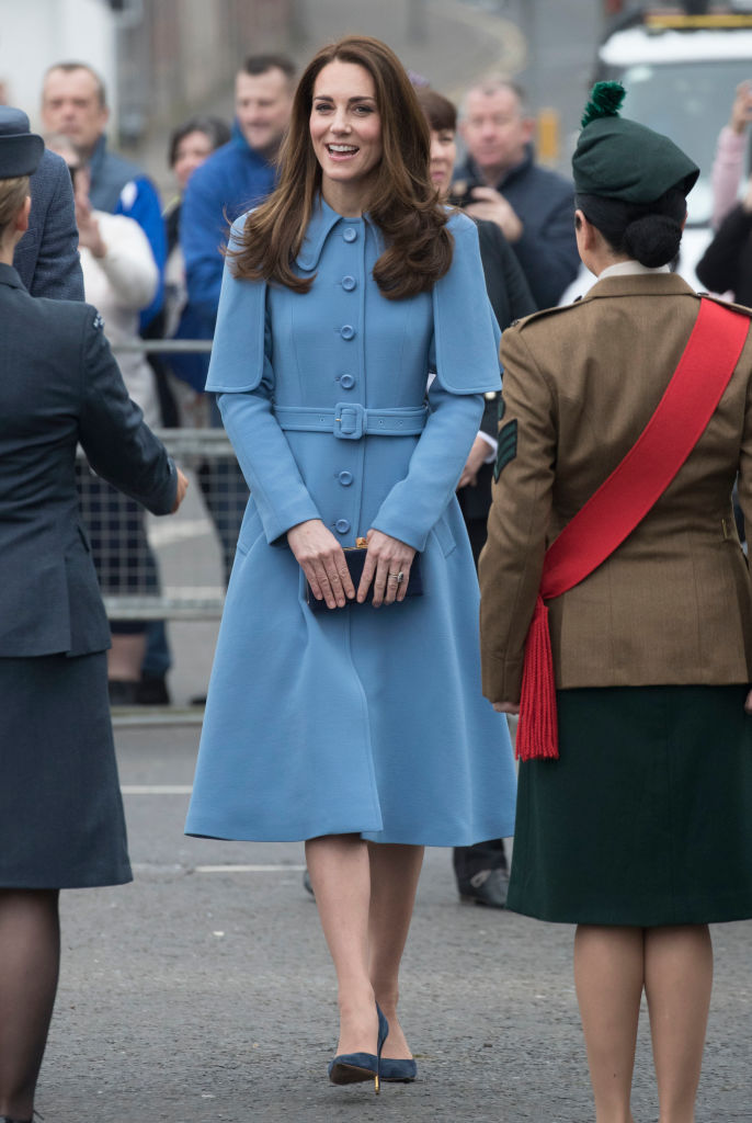 Kate Middleton wearing blue coat dress during a visit to Northern Ireland