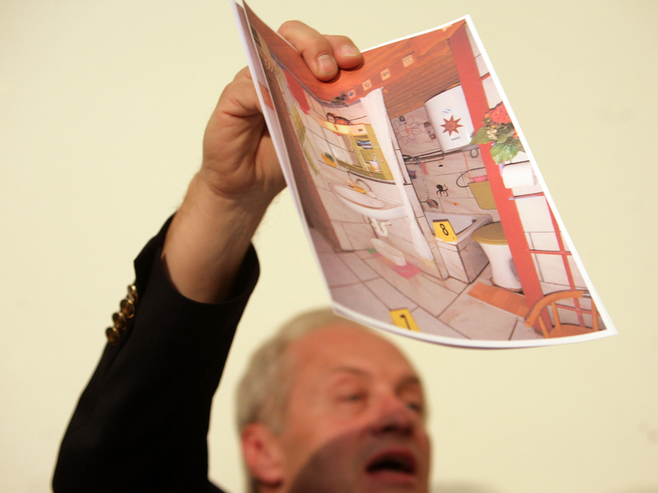 Colonel Franz Polzer shows a detail picture of the cellar apartment Elisabeth was imprisoned in during a press conference on April 28, 2008 in Amstetten, Austria.