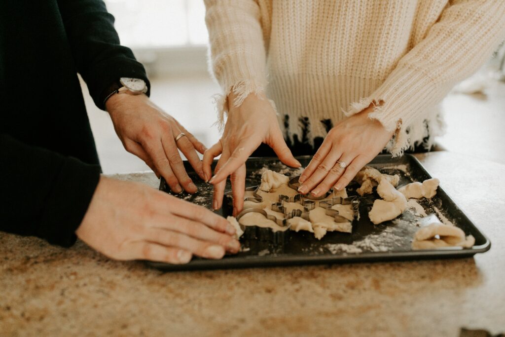 Image of man and woman baking cookies together.