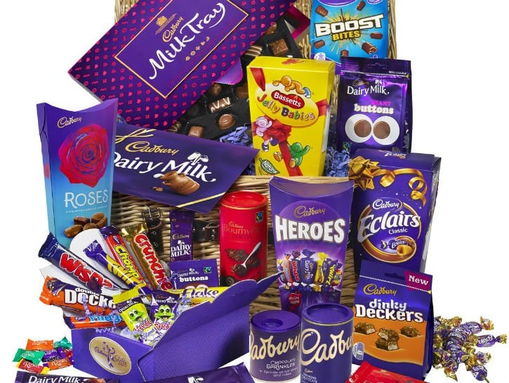 Large assortment of Cadbury candies in a gift basket. 