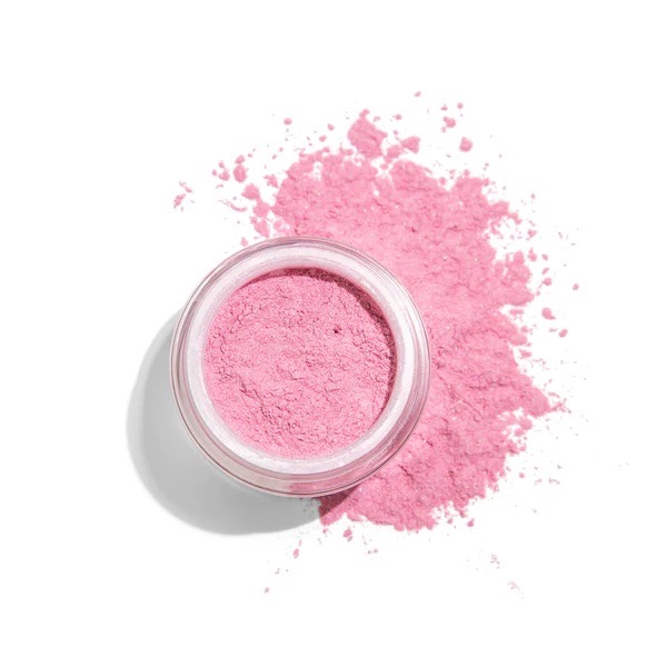 a pot of pink mineral powder blush spilling over