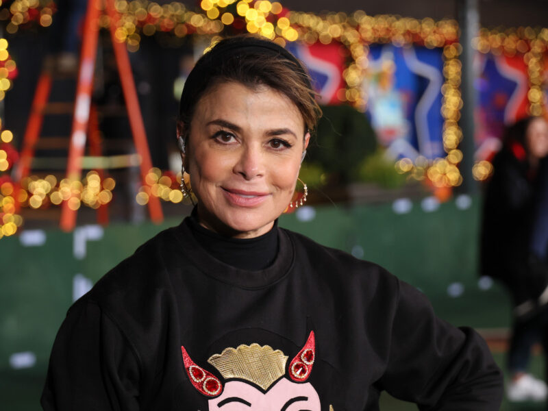 Paula Abdul smiling in a black sweater during rehearsal for the Macy's Thanksgiving Parade 2022