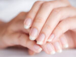 Woman's hands showcasing long, healthy natural nails