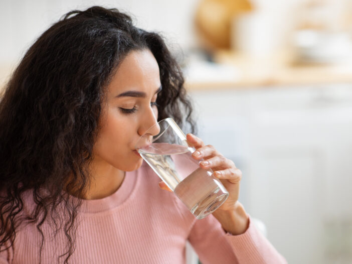 Image of woman drinking water.