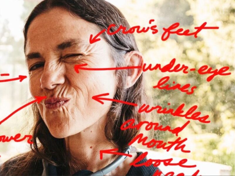 Justine Bateman's face with wrinkles described in red pen