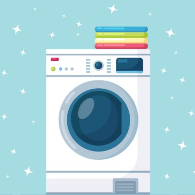 Front-load washing machine surrounded by sparkles