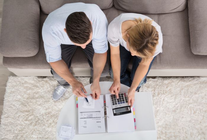 Overhead shot of couple working on finances together
