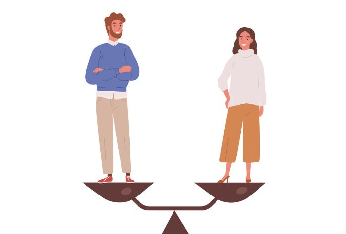 Couple stand on balanced scale
