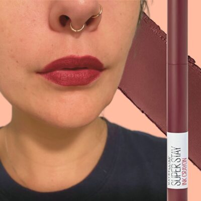 Woman with Maybelline Superstay Ink Crayon on lips, picture of product beside face