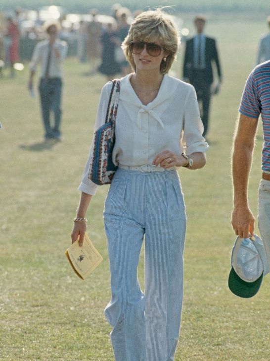 Princess Diana in flowy top and high waisted trousers, sunglasses, outdoors