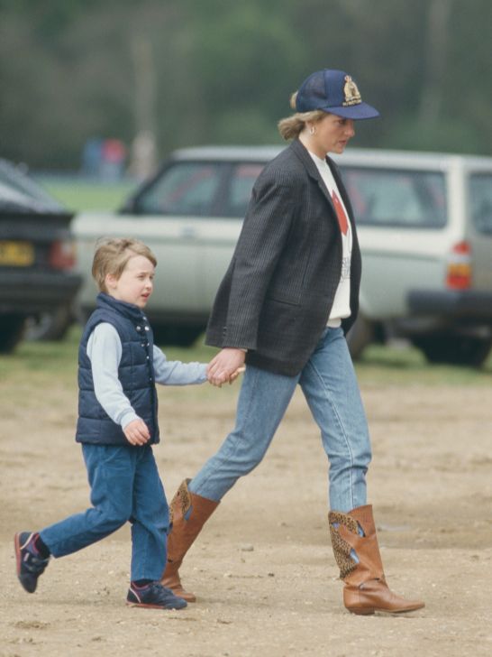 Princess Diana with Prince William at outdoor event