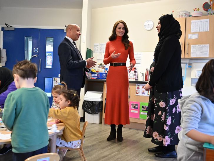 Kate Middleton in an orange ensemble visiting Foxcubs Nursery in 2023