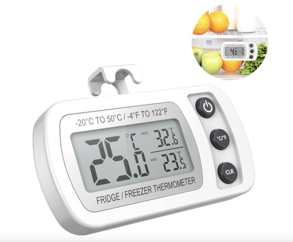 A fridge thermometer on a white background