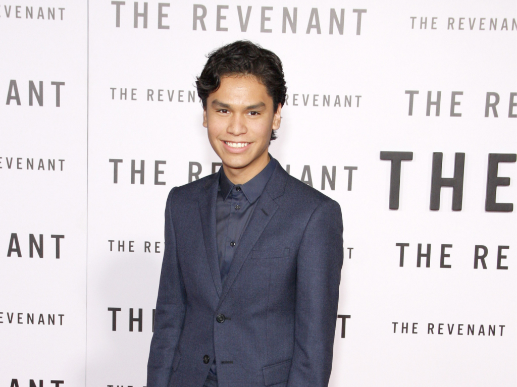 Forrest Goodluck, best known for The Revenant, poses on the red carpet