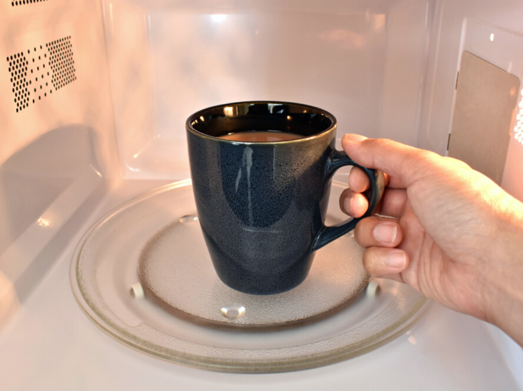 Reheating coffee in microwave, increasing risk of bacteria growth
